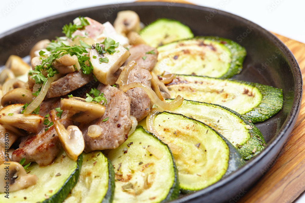 meat with vegetables on the pan