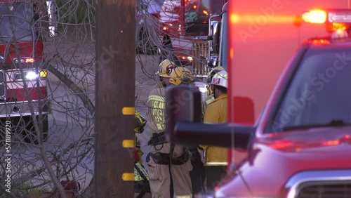 Firefighters conduct a hoist operation  photo