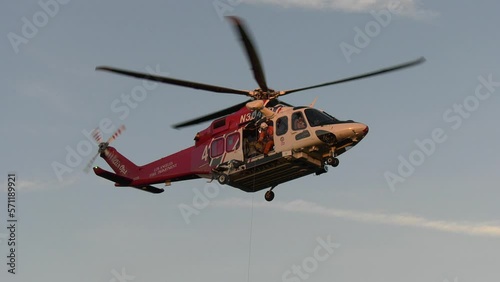 Rescue helicopter conducting lift operations