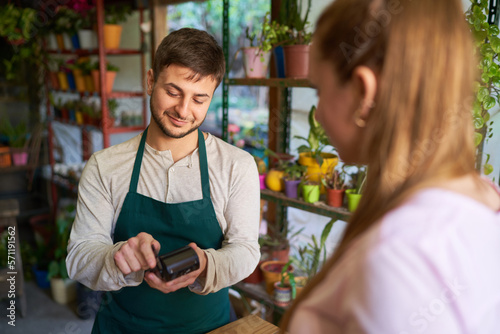 Florist and customer making contactless payments