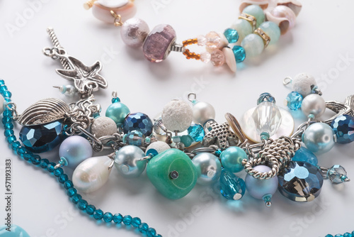 author braceletes with pearls and gemstones. fashion and jewelry concept