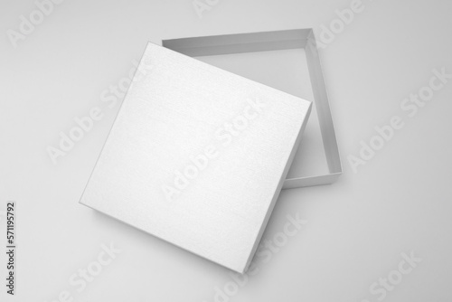 White textured opened box, gift mockup on white background.High resolution photo. Blank White Product Package Box Mock-up. Container, Packaging Template on white. Cardboard box. © MarijaBazarova