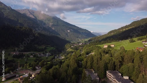 Flight over a forested valley  in the siwss alps. Close to the town of Fiesch. photo