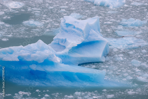 Deep blue and white chunks of ice of the famous glacier and natural sight Perito in the turquoise water of Lago Argentino in Patagonia, Argentina, South America 