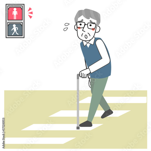 道路を渡り切れず信号が赤になって困っているシニア男性