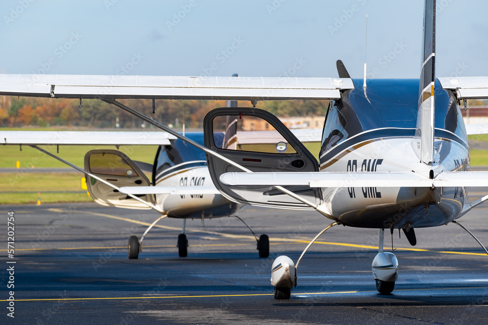 Two small planes prepare to flight on airport. - obrazy, fototapety, plakaty 