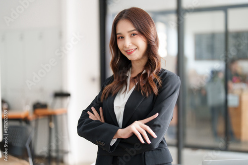 Beautiful asian business woman working at office. Financial analysis and tax concept.