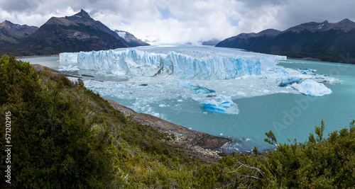 Panorama of the famous glacier and natural sight Perito Moreno with the icy waters of Lago Argentino in Patagonia, Argentina, South America 