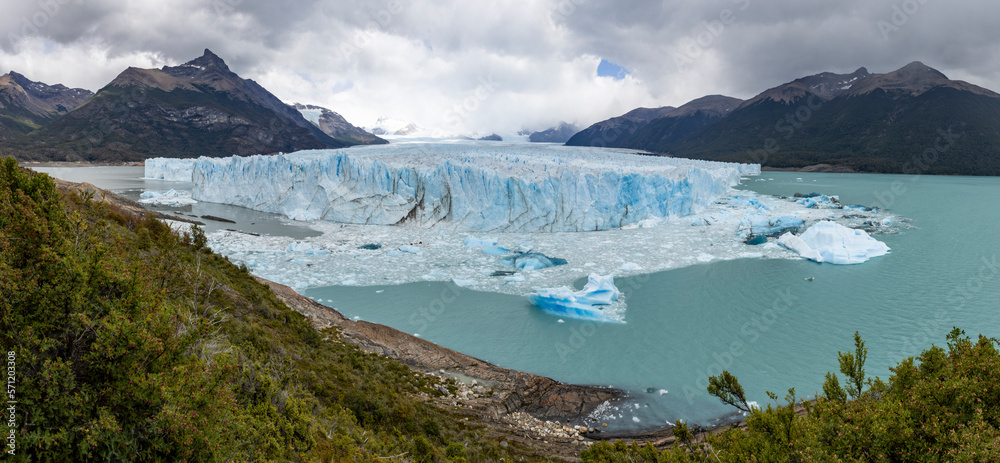 Panorama of the famous glacier and natural sight Perito Moreno with the icy waters of Lago Argentino in Patagonia, Argentina, South America 