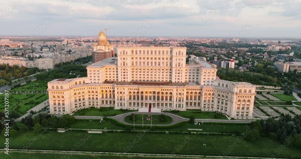 Palace of Parliament in Bucharest, Romania history Center aerial view at dawn in summer against blue sky Palace of Parliament in Bucharest, Romania history Center aerial view at dawn in summer against blue sky