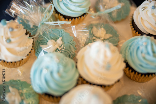 Child's baptism christening party. Blue and white sweets biscuits with a baby angel. High quality photo