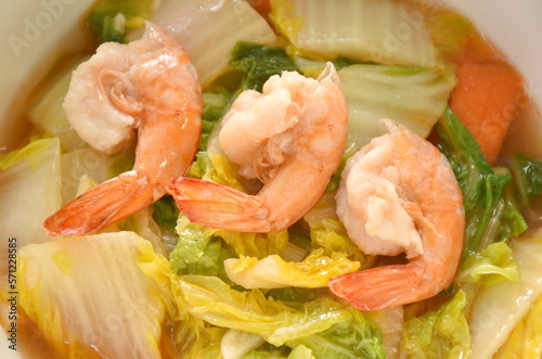 fried slice Chinese green cabbage and carrot with shrimp in soy sauce on bowl 