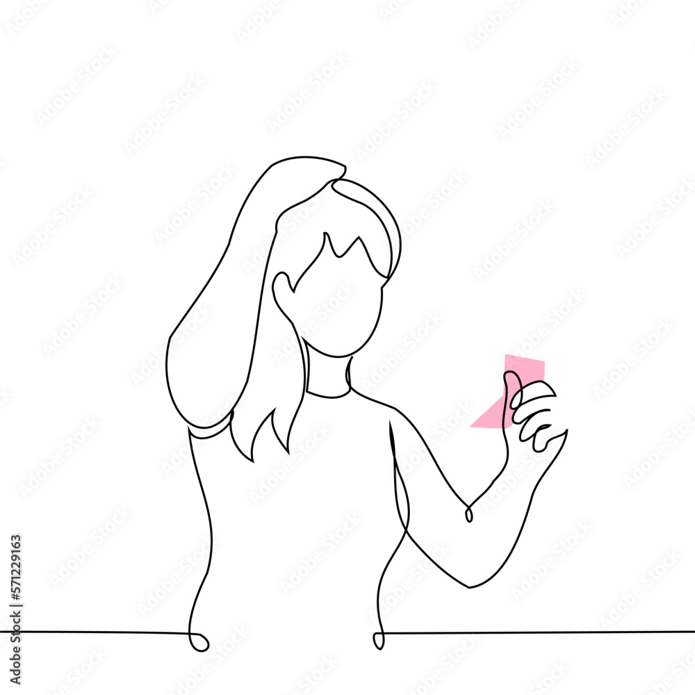 woman fixes her hair while looking in a small mirror - one line drawing vector. concept preen woman fixes her hair while looking in a small mirror - one line drawing vector. concept preen