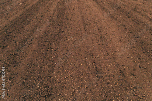 Ploughed soil in perspective as background