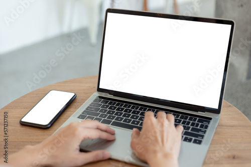 computer screen,cell phone blank mockup.hand woman work using laptop texting mobile.white background for advertising,contact business search information on desk in cafe.marketing,design