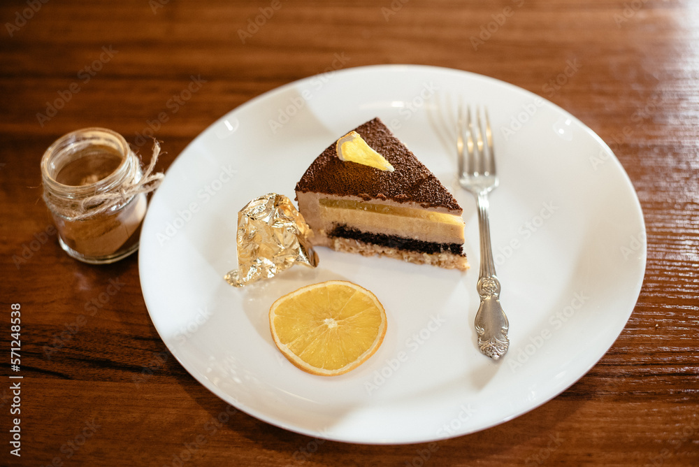 Caramel-orange-mousse cake with mirror glaze. Autumn cake. French Caramel-orange-mousse cake with mirror glaze. Autumn cake. French