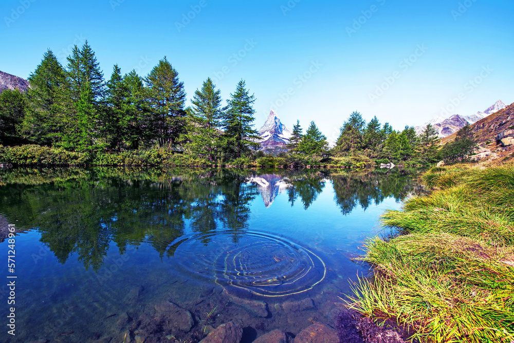 picturesque beautiful landscape with lake and fir trees on background Matterhorn in the Swiss Alps, near Zermatt, Switzerland. Amazing places. (Meditation, antistress - concept).