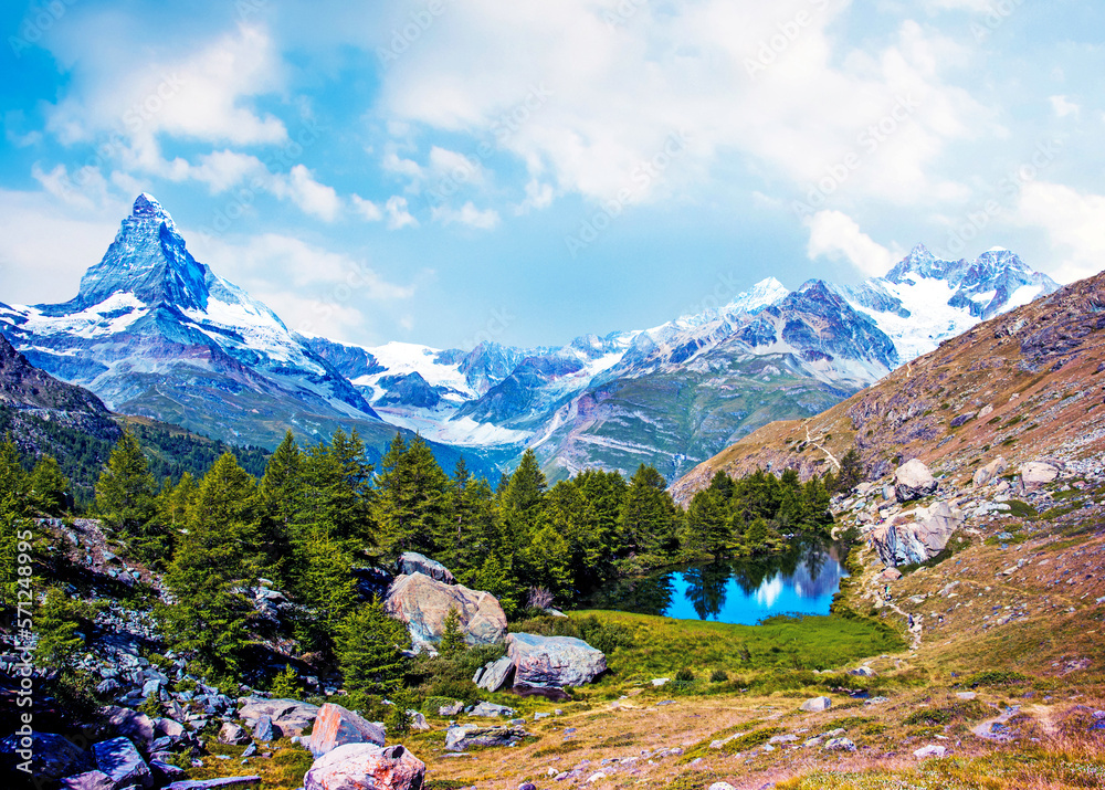 Magical beautiful autumn landscape with fir trees near lake on background Matterhorn in the Swiss Alps, near Zermatt, Switzerland. Amazing places. (Meditation, antistress - concept).