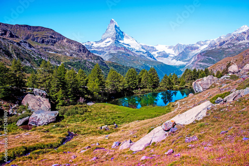Obraz na płótnie Magical beautiful autumn landscape with fir trees near lake on background Matterhorn in the Swiss Alps, near Zermatt, Switzerland. Amazing places. (Meditation, antistress - concept). w salonie