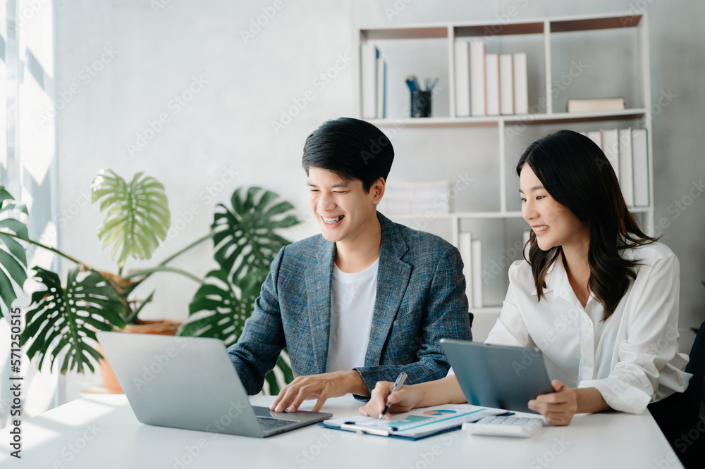 Businesswomen work and discuss their business plans. A Human employee explains and shows her colleague the results paper in modern office.. Businesswomen work and discuss their business plans. A Human employee explains and shows her colleague the results paper in modern office..