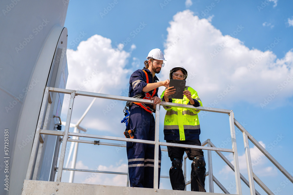 Wind turbine service engineer stand on platform plan for maintenance electricity generator Wind turbine service engineer stand on platform plan for maintenance electricity generator