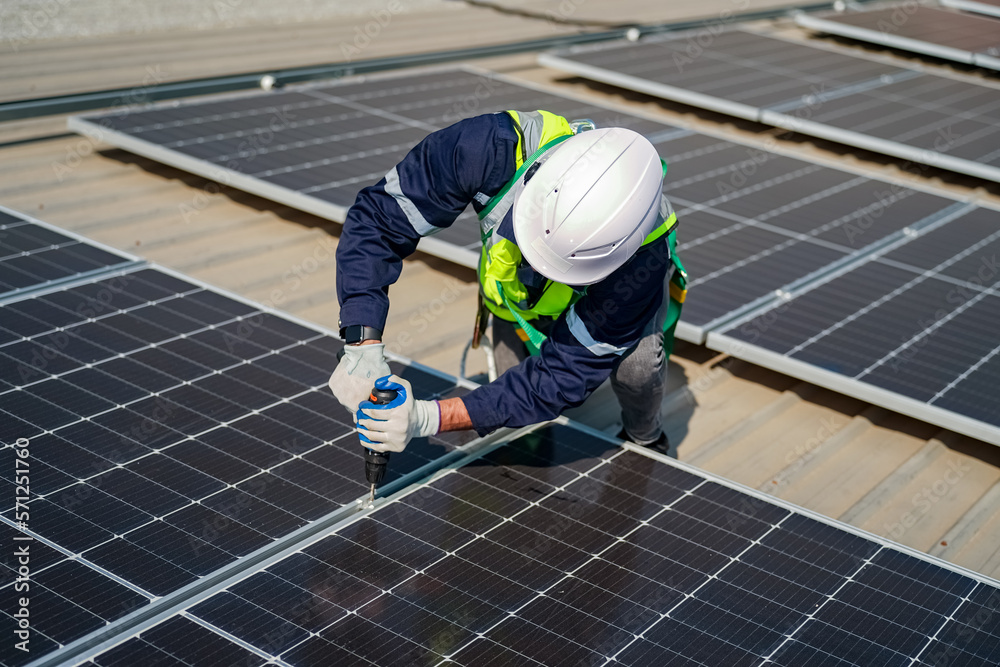 Technology solar cell, Engineer service check installation solar cell on the roof of factory. technician checks the maintenance of the solar panels Technology solar cell, Engineer service check installation solar cell on the roof of factory. technician checks the maintenance of the solar panels