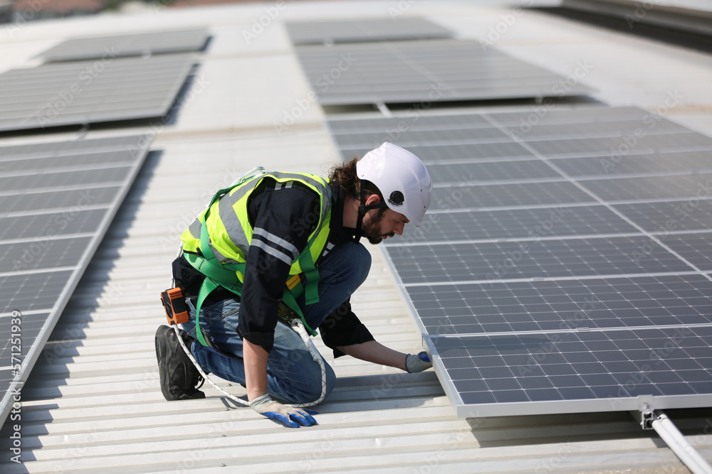 Technology solar cell, Engineer service check installation solar cell on the roof of factory. technician checks the maintenance of the solar panels Technology solar cell, Engineer service check installation solar cell on the roof of factory. technician checks the maintenance of the solar panels