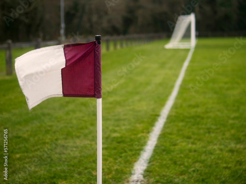 Purple and white corner flag on a football or soccer training ground. County Galway team colors, Ireland. Nobody. Selective focus