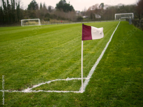Purple and white corner flag on a football or soccer training ground. County Galway team colors, Ireland. Nobody. Selective focus