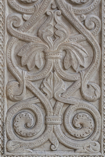 Antique carved stone bas-relief with a floral pattern