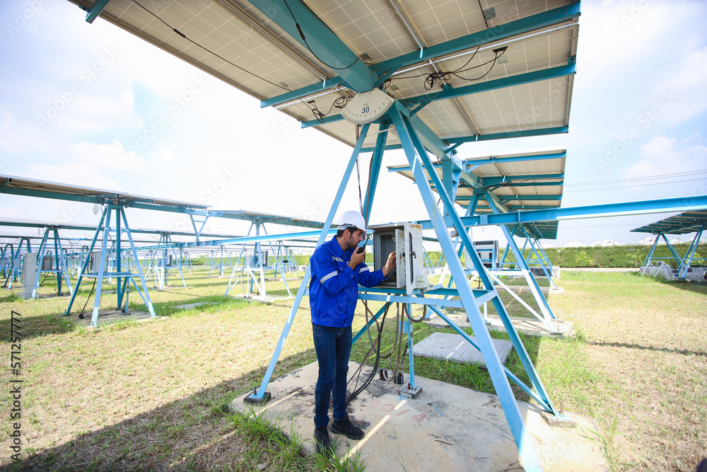 Technology solar cell, Engineer service check installation solar cell on the roof of factory. technician checks the maintenance of the solar panels Technology solar cell, Engineer service check installation solar cell on the roof of factory. technician checks the maintenance of the solar panels