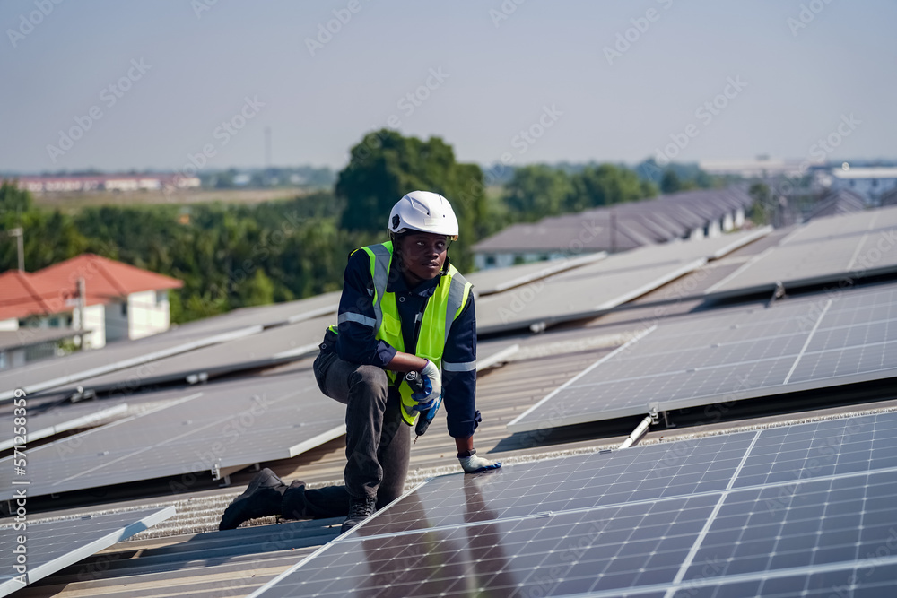 Technology solar cell, Engineer service check installation solar cell on the roof of factory. technician checks the maintenance of the solar panels Technology solar cell, Engineer service check installation solar cell on the roof of factory. technician checks the maintenance of the solar panels