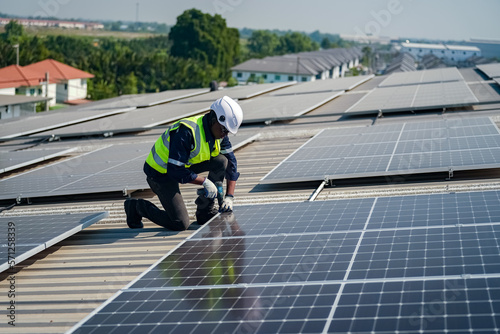 Technology solar cell, Engineer service check installation solar cell on the roof of factory. technician checks the maintenance of the solar panels