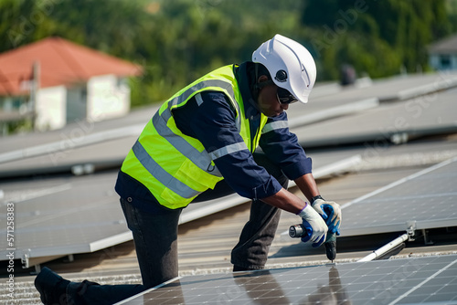 Technology solar cell, Engineer service check installation solar cell on the roof of factory. technician checks the maintenance of the solar panels © FotoArtist