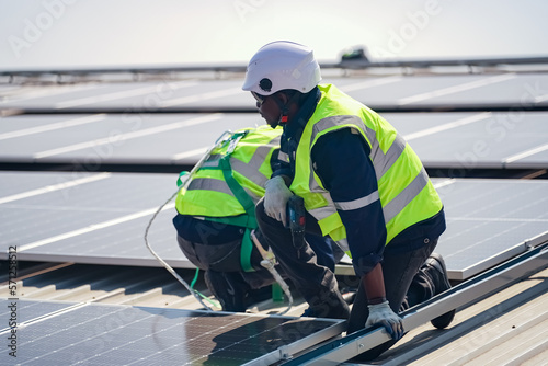 Wallpaper Mural Technology solar cell, Engineer service check installation solar cell on the roof of factory. technician checks the maintenance of the solar panels Torontodigital.ca