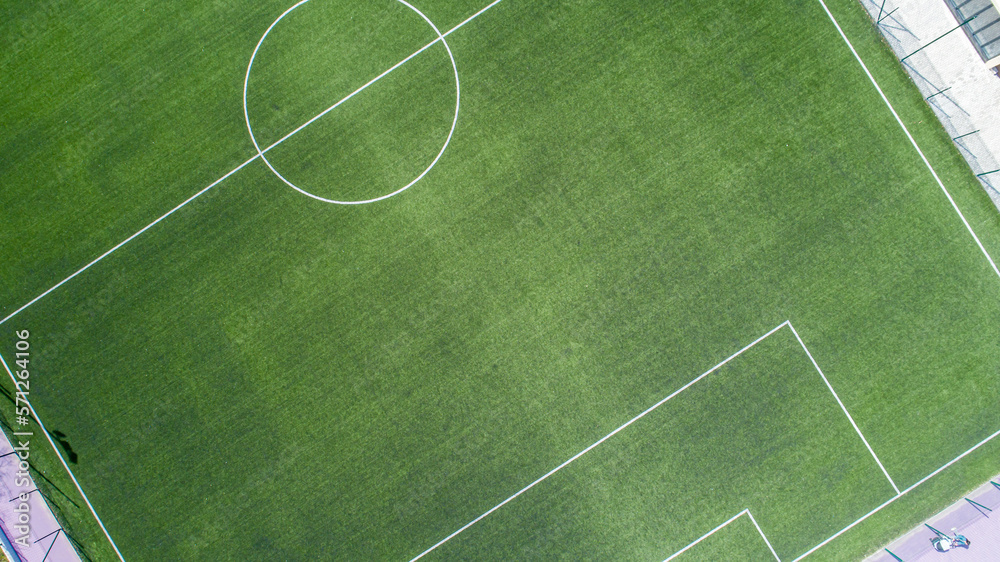 Aerial view of green football, soccer pitch. Top down view on a green, empty soccer field Stock