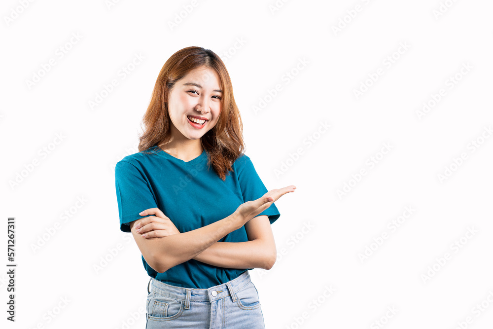 Asian woman in blue shirt standing on white background making hand gesture Asian woman in blue shirt standing on white background making hand gesture