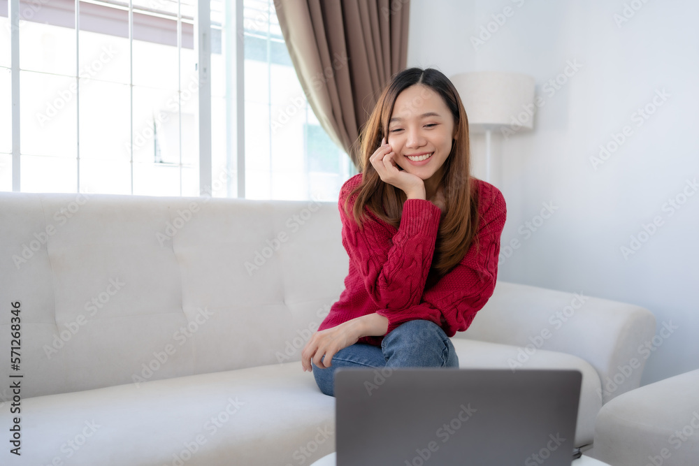 Beautiful Asian woman having video call chatting with friend using laptop with a smiling and fun face and a happy. Beautiful Asian woman having video call chatting with friend using laptop with a smiling and fun face and a happy.