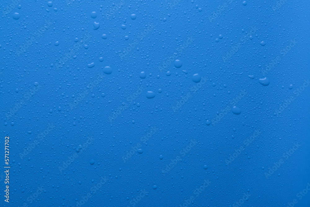 Water drops on blue color surface Water drops on blue color surface