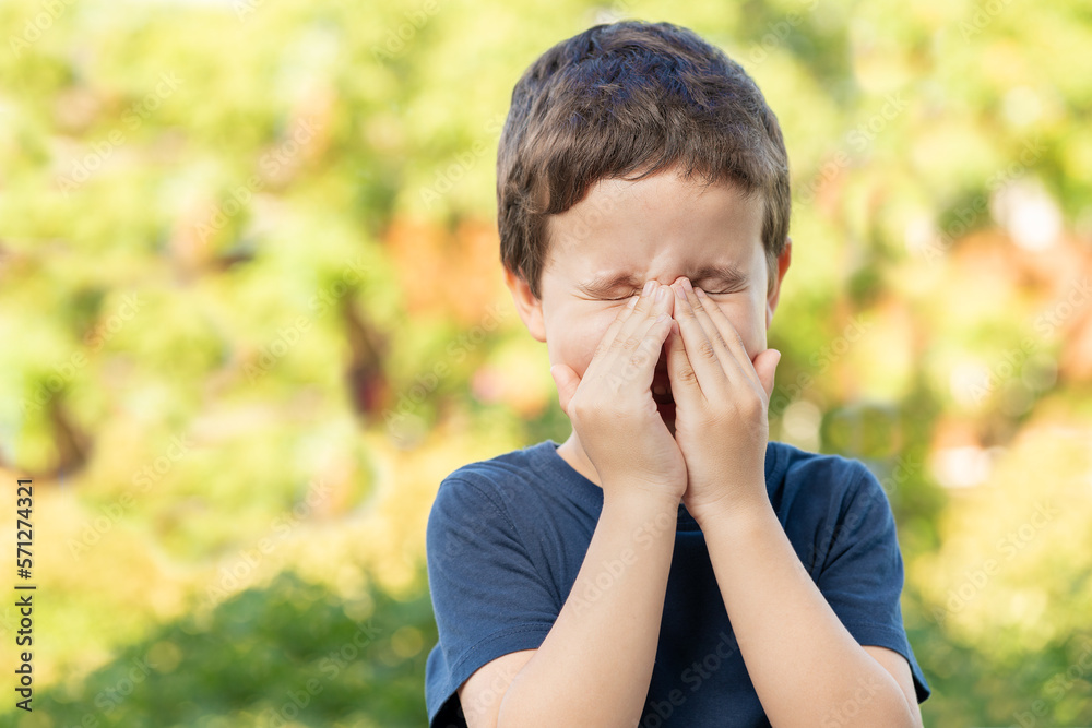 Child with allergy coughing in a green color field in summer - obrazy, fototapety, plakaty 