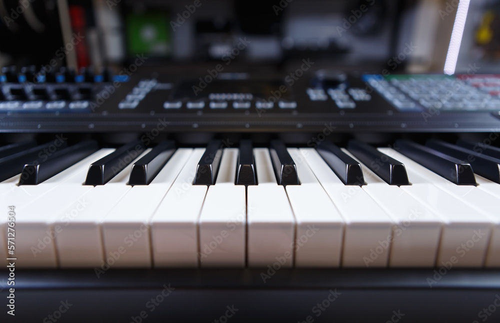 Synthesizer piano in music store. Buy modern synth device and compose music