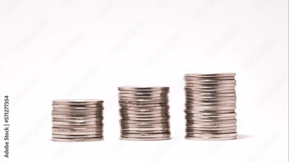 stop motion stack of silver coins on white background stop motion stack of silver coins on white background