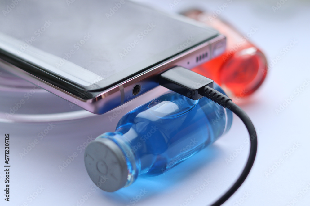 The process of fast charging a smartphone via a USB cable. Stock Photo ...