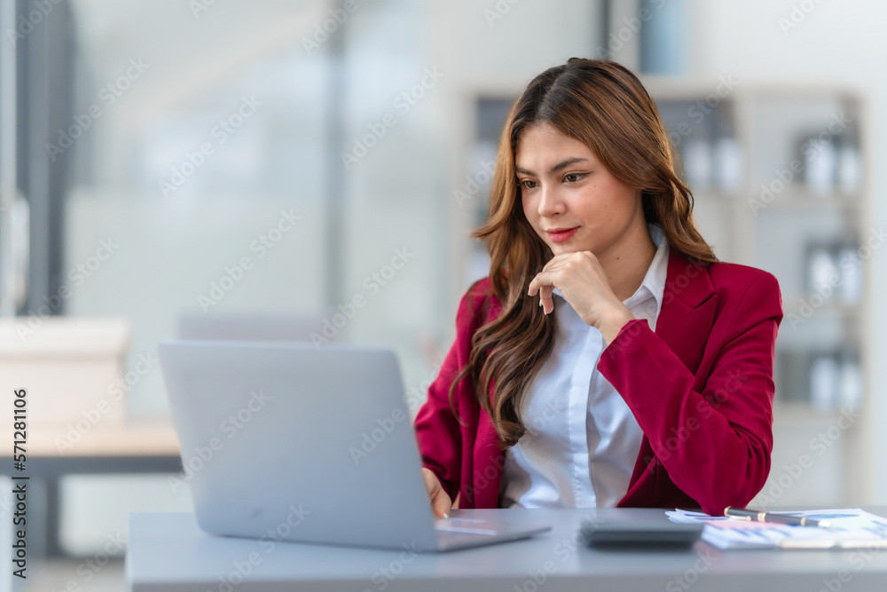 Young pretty business woman bookkeepers online consult on laptop with stock market earning and profit, tax, yearly planning, Powerful expert management complete bookkeeping service and solutions Young pretty business woman bookkeepers online consult on laptop with stock market earning and profit, tax, yearly planning, Powerful expert management complete bookkeeping service and solutions