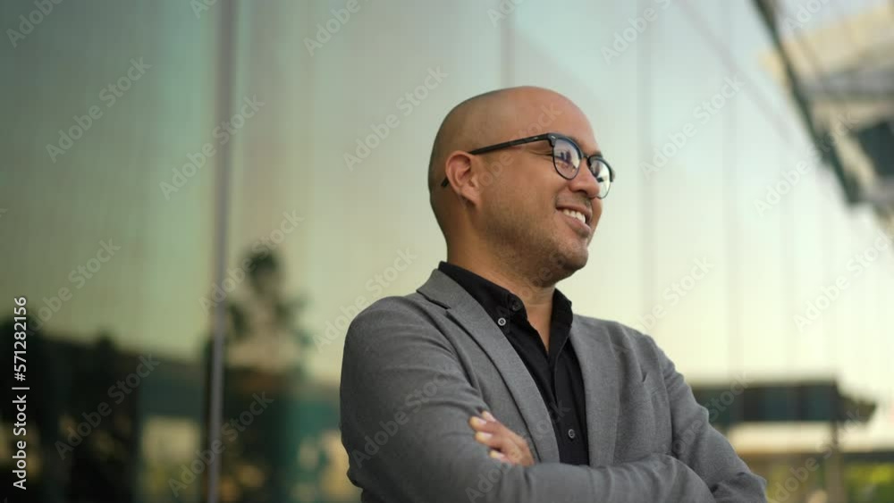 Confident smartly businessman manager smiling and arms crossed standing in a modern office. CEO, business owner proud of his success goals. Portrait Middle eastern businessman trader smiling. Confident smartly businessman manager smiling and arms crossed standing in a modern office. CEO, business owner proud of his success goals. Portrait Middle eastern businessman trader smiling.