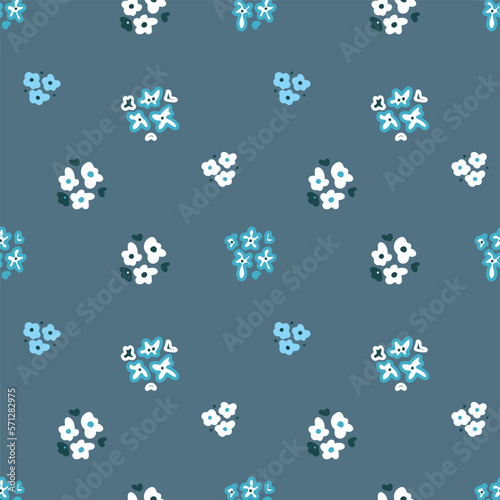 Pattern of small flowers on a gray background. Seamless vector image.