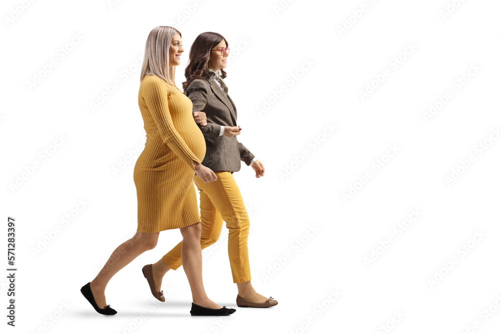 Pregnant woman walking holding another woman and walking Pregnant woman walking holding another woman and walking