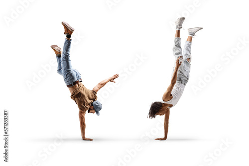 Fototapeta Naklejka Na Ścianę i Meble -  African american male dancer and a caucasian performing a handstand