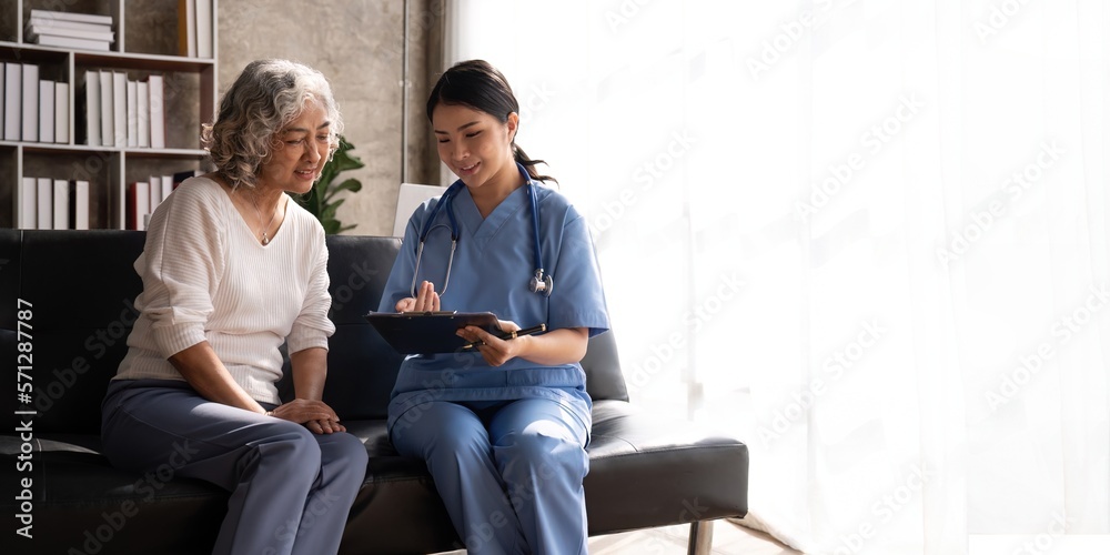 Smiling female doctor showing test results to patient in hospital. Sick senior woman having a doctor appointment. Medical consultation Smiling female doctor showing test results to patient in hospital. Sick senior woman having a doctor appointment. Medical consultation