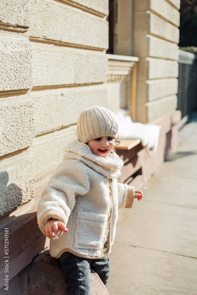 Little cute daughter of 4 years old walks in the center of the old city. Europe. Family. Little cute daughter of 4 years old walks in the center of the old city. Europe. Family.